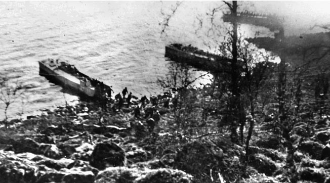 British landing craft with French and Norweigian soldiers aboard land north of Narvik.