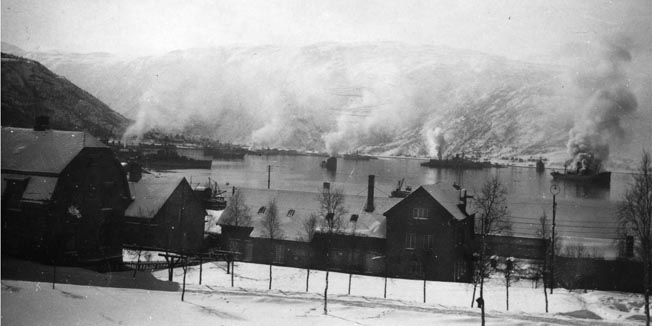 German merchant ships, filled with supplies for the invading forces, burn in Ofotfjord near Narvik after a battle with the British Royal Navy and warplanes, April 1940.
