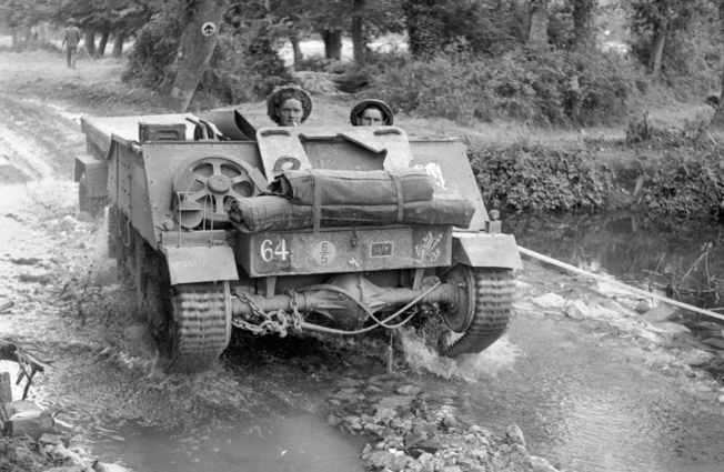 A Loyd carrier of the 8th Middlesex Regiment advances during the British attack in the Odon Valley, July 16—part of the fight to take Hill 112.