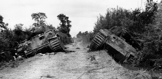 Two German Mark V Panthers of the Panzer Lehr Division lie destroyed after British attacks on July 13, 1944.